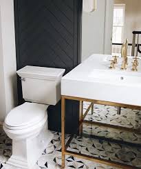Black And White Tile Powder Room Andrea Wilson On Instagram The Prettiest Little Powder Bath Love Love The Herringbone Accent Wall In 2020 Powder Room Vanity Black Powder Room White Tile Floor
