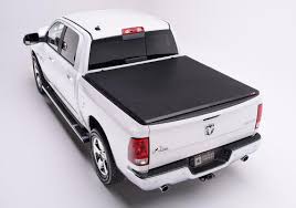 Hard folding aluminum tonneau cover with integrated contractor rack. American Tonneau