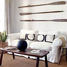 An awesome decorating idea for your kitchen or garden. Decorating Ideas With Wooden Oars Paddles Wall Decor Racks Handrails More Coastal Decor Ideas Interior Design Diy Shopping