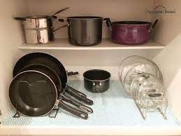 Organize pots and pans in cabinet as previously mentioned you can use lid organizers inside the doors or installed inside the cabinet walls to keep your lids organized. 11 Genius Ways To Organize Pots Pans Organization Obsessed