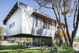 A Raised Beach House Keeps Above Water In A Flood Prone Area Beach House Plans Beach House Exterior House On Stilts