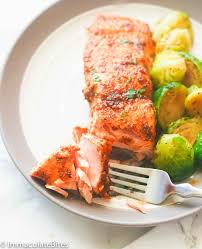 Oven Baked Salmon Moist And Flaky Highly Seasoned Salmon Fillets With A Lemony And Spicy Kick A Oven Baked Salmon Salmon Recipes Oven Salmon Fillet Recipes
