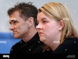 Jane Bowden, the fiancee of murdered father Peter Woodhams, cries as  Woodham's father, Peter Woodhams (correct) speaks during a news conference  at Snow Hill police station, London Stock Photo