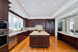 Natural elements and plenty of texture in cabinets, floors and countertops define the mediterranean look. Boston Weston Exquisite Traditional Residence Kitchen Divine Design Center
