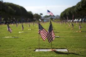 Usa memorial day concept with dog tags and red remembrance poppy on american stars and stripes flag on dark blue vintage wood table. 5 Ways To Celebrate Memorial Day It S Memorial Day Weekend And People By Band Medium