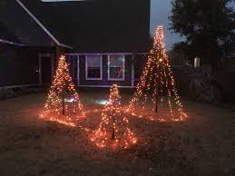 Diy Easy Christmas Tree Lights For Your Backyard Simple Christmas Tree Christmas Tree Lighting Outdoor Christmas Tree