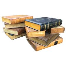 The faux painted books with the top one set at a slight angle. Book Stack Table 8 For Sale On 1stdibs