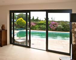 Large Double Sliding Patio Door With Black Frame Facing Garden Pool Fabulous Double Sliding Patio Door Glass Doors Patio Sliding Glass Doors Patio Patio Doors