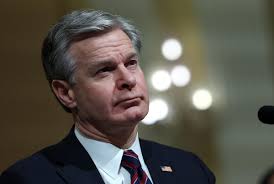 FBI Director Wray walked a tightrope with Trump. Here's how it went wrong