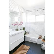 We've seen white tiles with black grout incorporated a lot, but this is the first time we've seen it in reverse. Black And White Penny Tile Bathroom Floor Trendecors