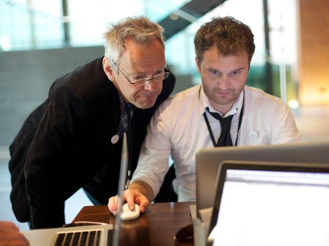 The classic 'hover'—a micromanager's signature move., AI generated