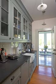 If you are looking for more of a dramatic charcoal gray, iron mountain might be for you. 75 Beautiful Kitchen With Glass Front Cabinets And Gray Cabinets Pictures Ideas June 2021 Houzz