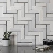 Mystic cloud (aka white oak) arched herringbone honed marble mosaic is rich with shades of cool and warm whites in a natural linear pattern echoing natural oak. Designing With Herringbone Tiles Belk Tile