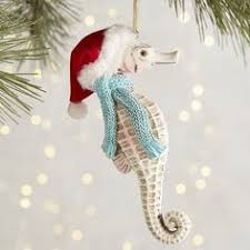 Add some 3 ft glittered candles to the display for a more festive effect. 560 Beach Holiday Ideas Beachy Christmas Beach Christmas Coastal Christmas