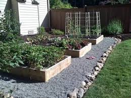 Some people take this a step further and use garden or. Garden And Yard Looks Like Rocks In The Ditch Between Hard To Mow Or Keep Weeds Out Maybe Pavers Instead Since W Garden Beds Raised Garden Garden Yard Ideas