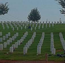 Culpeper National Cemetery Note The Person Sitting By The Grave Of A Loved One 3 National Cemetery Culpeper Cemetery