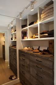 Fantastic Walk In Closet With Track Lighting Floor Mirror Rustic Chest Of Drawers In An Antique Finish And Rustic Closet Walk In Closet Design Closet Design
