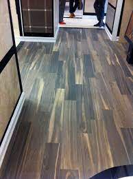 The beautiful textured look of authentic wood is replicated on a ceramic surface; Real Wood Floor Vs Ceramic Wood Look Tiles