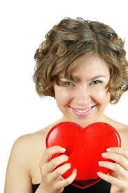 Cupido Con La Ragazza in Vestito Rosso Immagine Stock