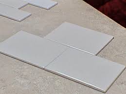 You can use a plastic tile bath trim which is self adhesive,l shaped with a rubber edge. How To Tile Bathroom Walls And Shower Tub Area How Tos Diy