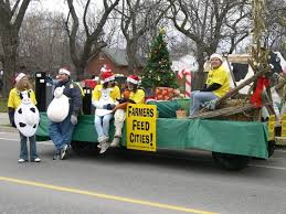 Turn your parade float into a festival of lights by using different types of light sources. Here S A Farmers Feed Cities Float In A Christmas Parade Christmas Parade Floats Christmas Parade Christmas Float Ideas