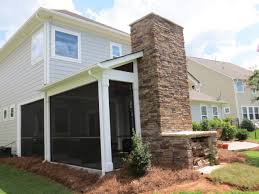 A screened porch can also be constructed in three phases. Screened Porch With Wood Burning Fireplace And Paver Patio Deckscapes
