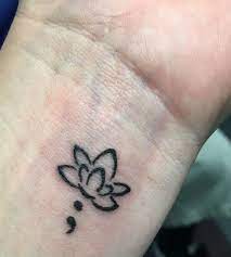 First Tattoo Lotus With A Semi Colon Lotus As A Reminder To Strive For Inner Peace And Semi Colon Because I Fought Tattoos Foot Tattoos Foot Tattoos For Women