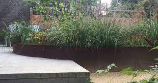 ronde vormen in de tuin maar toch een strak en modern tuinontwerp ja het kan zie onderstaand de nieuwste cyntuin tuin ronde vormen tuin tuin cortenstaal