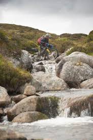Crossing A Burn Near Ben Alder On A Mountain Bike Adventure Holiday Adventure Bike Mountain Biking Adventure Holiday