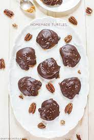 Next, place a caramel on top of each pretzel. Homemade Chocolate Turtles With Pecans Caramel Averie Cooks