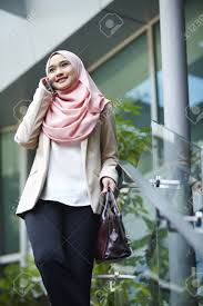 Lowest price guaranteed | cashback deals | shopee mall. Young Malay Woman Talking On The Phone In Front Of Office Building Stock Photo Picture And Royalty Free Image Image 80135298