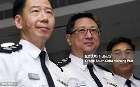 Newly appointed Commissioner of Police Stephen Lo Wai-chung , flanked...  News Photo