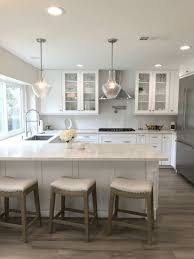 Kitchen Design With Wood Look Porcelain Tile Marbled Quartz Countertops And White Subway Backsplash Natura Kitchen Design Home Decor Kitchen Kitchen Remodel
