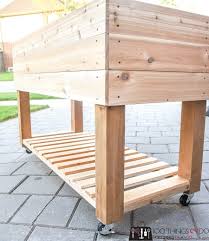 You create raised garden beds by building a large container and filling it with soil, compost, and aerating materials. Building A Raised Garden Bed On Wheels Building Our Raised Beds The Prairie Homestead