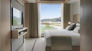 The suite has 1 queen bedroom along with a murphy queen bed in the living room. 5 Star Resort On Patong Beach Accommodation Amari Phuket One Bedroom Suite Ocean Facing