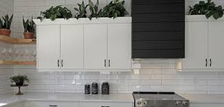 Make a small kitchen look larger by connecting your backsplash and countertops for a cohesive look. 15 Ways To Make A Small Kitchen Look Bigger Handyman Corporate