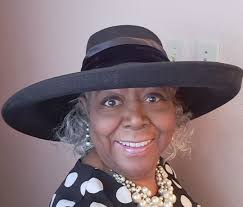 Sorting out sports team hats collection, including Giants and 49ers