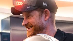 Prince Harry is all smiles as he joins LA Rams in the locker room after  Super Bowl win