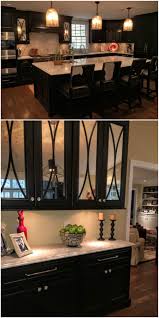 Dark Painted Kitchen Mercury Glass Fronted Doors With Arched Mullions Light Countertop Kitchen Cabinets Upgrade Painting Kitchen Cabinets Glass Cabinet Doors