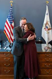 Kamala harris is sworn as vice president as her husband holds two bibles. On The Profoundly Modern Marriage Of Kamala Harris And Doug Emhoff Vogue