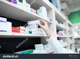 Closeup View Of Pharmacist Hand Taking Medicine Box From The Shelf In Drug Store Pharmacy And Health Care Ad S Fertility Medications Pharmacist Fertility