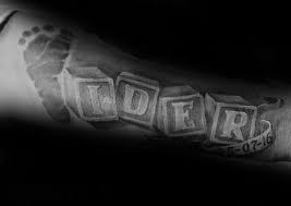 The black lettering is bold and dramatic while maintaining a simplicity that many prefer over the complexity and bright colors of other designs. Top 43 Kids Name Tattoo Ideas 2021 Inspiration Guide
