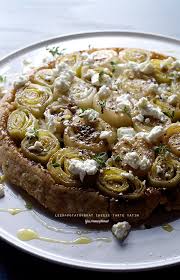 Working within the border, spread the arrange the potato slices in a single layer on top of cheese mixture and brush the potatoes with the melted butter. Leek Potato Goat Cheese Tarte Tatin