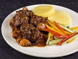 Add 4 quarts water, smoked turkey, onion and a generous pinch of salt. Jamaican Brown Stew Turkey Neck Recipe Jamaican Medium Recipes