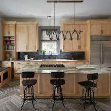 Accent colors include a deep brown range hood, black kitchen island, and deep grey marble countertops. 75 Beautiful Kitchen With Light Wood Cabinets Pictures Ideas August 2021 Houzz