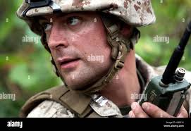 A U.S. Marine Corps landing support specialist with Landing Support  Battalion, 2nd Combat Logistics Regiment, 2nd Marine Logistics Group (MLG),  conducts equipment and vehicle checks during railhead operations at the  Morehead and