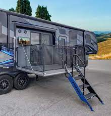 This fifth wheel with a side patio actually has a ramp door that converts into the patio, making it practical and durable. Fuzion 420 Toy Hauler Double The Patios Double The Fun