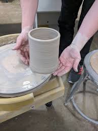 throwing a clay cylinder on the potters wheel 22 steps