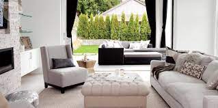 Modern cozy living room with lake view and white leather sofa. House Tour Cozy Modern Family Home Style At Home