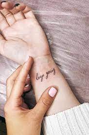 Keep Going Tattoo Design For Wrist Letteringtattoo Meaningful Wrist Tattoos Simple Wrist Tattoos Tattoos For Women Small Meaningful